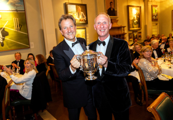 The main prize: Mark Nicholas accepts the Walter Lawrence Trophy from Matthew Fleming on behalf of the absent 2022 winner, Paul Stirling, who also receives a cheque for £2,500 and a special medallion.